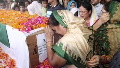 The last rites of Lance Naik Chandrashekhar Harbola were performed with full military honours at Haldwani, in Nainital district, on Wednesday. (AP)