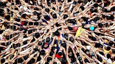 Youth make a human pyramid to reach and break the dahi handi as they celebrate Janamashtami. Youth make a human pyramid to reach and break the dahi handi as they celebrate Janamashtami.