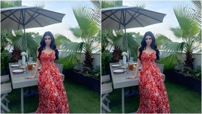 Mouni took over Dubai in a red and white slip long summer dress. The dress came with corset details and floral patterns in white shade. The attire cascaded to a flowy long dress below the waist. (Instagram/@imouniroy)