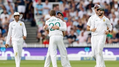 South Africa's Anrich Nortje celebrates with Dean Elgar after taking the wicket of England's Ben Foakes (Action Images via Reuters)