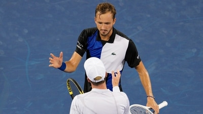 Daniil Medvedev, background, of Russia, shakes hands with Botic van de Zandschulp, of the Netherlands, after their match at the Western & Southern Open tennis tournament Tuesday, Aug. 16, 2022, in Mason, Ohio. (AP Photo/Jeff Dean) (AP) Daniil Medvedev, background, of Russia, shakes hands with Botic van de Zandschulp, of the Netherlands, after their match at the Western & Southern Open tennis tournament Tuesday, Aug. 16, 2022, in Mason, Ohio. (AP Photo/Jeff Dean) (AP)