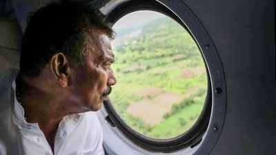 Tulsiram Silawat conducting an aerial survey after a breach in a wall of an under-constuction dam over Karam river was reported, at Kothida in Dhar district, Sunday, Aug 14, 2022. (PTI)