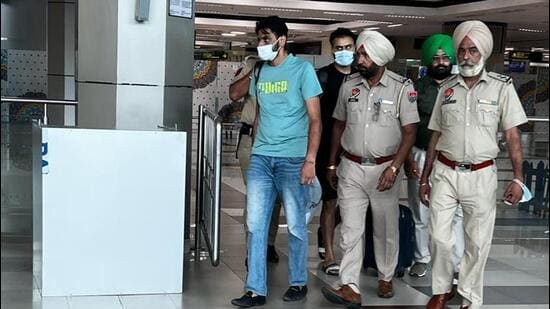 The accused, Harpal Singh and Fatehdeep Singh, who were arrested at the Delhi airport, being brought to Amritsar on Wednesday. (Sameer Sehgal/HT)