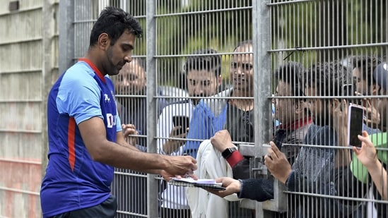R Ashwin signs autographs for fans after attending a training session in Birmingham, England(AP/File Photo)
