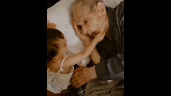 The baby girl and her great grandfather sharing a tender moment. (Instagram/@joanaconfraria)