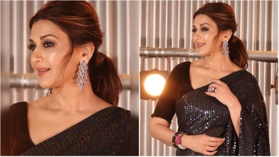 Sonali Bendre made jaws drop as she stepped out in this sequins black saree. She teamed her contemporary Indian look with earrings and thick bangles.(Instagram/@iamsonalibendre)
