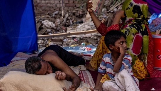 A&nbsp;Rohingya&nbsp;refugee family rests in a temporary shelter&nbsp;after a&nbsp;fire&nbsp;destroyed a Rohingya refugee camp in New Delhi,(REUTERS file)