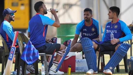 Indian cricket players take a rest during a practice session at Harare Sports Club ahead of their One-Day International cricket match against Zimbabwe in Harare, Zimbabwe, (AP)