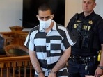 Hadi Matar, 24, center, arrives for an arraignment in the Chautauqua County Courthouse in Mayville, N.Y., Saturday, Aug. 13, 2022. Matar, is accused of carrying out a stabbing attack against “Satanic Verses” author Salman Rushdie.