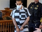 Hadi Matar, 24, center, arrives for an arraignment in the Chautauqua County Courthouse in Mayville, N.Y., Saturday, Aug. 13, 2022. Matar, is accused of carrying out a stabbing attack against “Satanic Verses” author Salman Rushdie.
