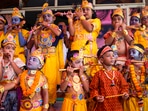 Children dressed up as Lord Krishna pose during a competition ahead of the upcoming festival of Janmashtami, in Bhubaneswar. To celebrate the festival, devotees prepare sweets, keep fast, decorate the temples and dress up in traditional clothes.(PTI)