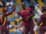 West Indies' Shamarh Brooks, left, celebrates with teammates Jason Holder and Shai Hope after taking the catch to dismiss New Zealand's Devon Conway during the first ODI at Kensington Oval in Bridgetown, Barbados West Indies' Shamarh Brooks, left, celebrates with teammates Jason Holder and Shai Hope after taking the catch to dismiss New Zealand's Devon Conway during the first ODI at Kensington Oval in Bridgetown, Barbados