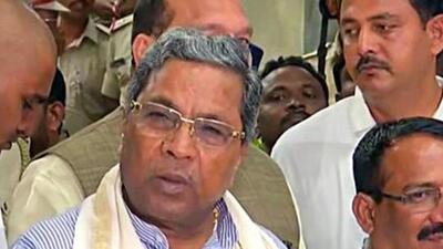 Several people, holding pictures of Hindutva ideologue Vinayak Damodar Savarkar and black flags, protested against Congress leader Siddaramaiah who visited Kodagu district to see the rain-related damages in the coffee-growing region. (ANI) Several people, holding pictures of Hindutva ideologue Vinayak Damodar Savarkar and black flags, protested against Congress leader Siddaramaiah who visited Kodagu district to see the rain-related damages in the coffee-growing region. (ANI)