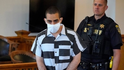 Hadi Matar, 24, center, arrives for an arraignment in the Chautauqua County Courthouse in Mayville, N.Y., Saturday, Aug. 13, 2022. Matar, is accused of carrying out a stabbing attack against “Satanic Verses” author Salman Rushdie. Hadi Matar, 24, center, arrives for an arraignment in the Chautauqua County Courthouse in Mayville, N.Y., Saturday, Aug. 13, 2022. Matar, is accused of carrying out a stabbing attack against “Satanic Verses” author Salman Rushdie.