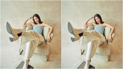 Ananya teamed a pastel blue corset off-shoulder cropped top with a pair of high-waisted ivory-white baggy trousers with wide legs. (Instagram/@ananyapanday)