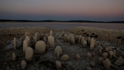 The dolmen of Guadalperal, also known as the Spanish Stonehenge, is seen due to the receding waters of the Valdecanas reservoir in the outskirts of El Gordo, Spain&nbsp; (REUTERS/Susana Vera)