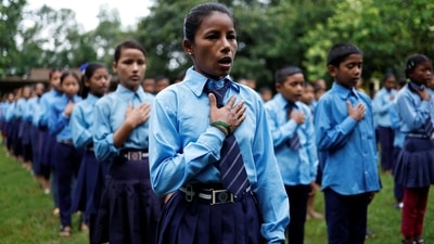 Parwati Sunar, 27, sings the national anthem of Nepal while attending an assembly at Jeevan Jyoti secondary school in Punarbas, Kanchanpur district, southwest Nepal. (REUTERS)