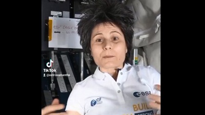 The image, taken from the Twitter video, shows an astronaut talking ‘weightlifting in weightlessness’. (Twitter/@AstroSamantha)