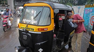 A passenger boards an autorickshaw at Swargate chowk on Thursday. (Ravindra Joshi/HT PHOTO)