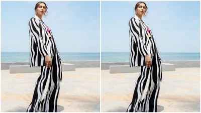 Rakul Preet earlier promoted her film Runway 34 wearing a monochrome stripped pantsuit teamed with a pink bralette from the same label. (Instagram/@rakulpreet)