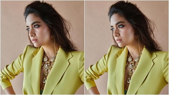 Keerthy paired a lemon-yellow blazer with lapel collars and pockets at the sides with a pair of lemon-yellow trousers as she posed like a diva.(Instagram/@keerthysureshofficial)