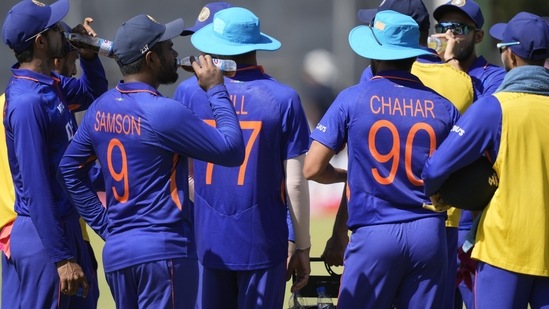 Indian cricket players are seen during a drinks break on the first day of the One-Day International cricket match between Zimbabwe and India at Harare Sports Club in Harare, Zimbabwe, Thursday, Aug, 18, 2022. (AP Photo/Tsvangirayi Mukwazhi)(AP)