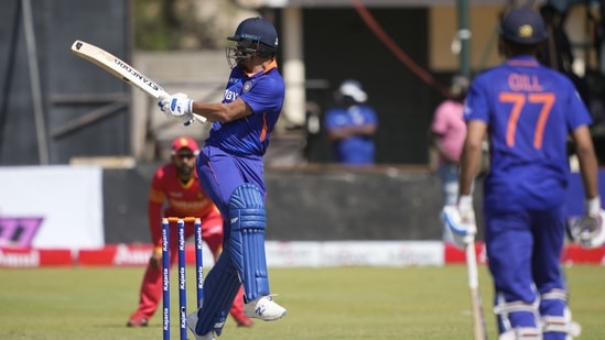 Indian batsman Shikhar Dhawan, left, in action on the first day of the One-Day International cricket match between Zimbabwe and India(AP)
