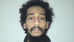 Captured British Islamic State (IS) group fighter El Shafee Elsheikh, posing for a mugshot in an undisclosed location.