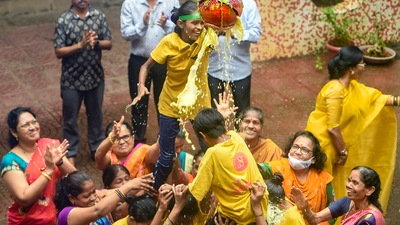 Students of Kamala Mehta School for Blind form a human pyramid to break the Dahi Handi during Krishna Janmashtami festival celebrations in Mumbai. (PTI)