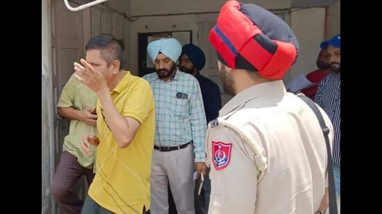 The Punjab vigilance bureau team at the regional transport authority (RTA) office in Sangrur on Friday. (HT Photo)