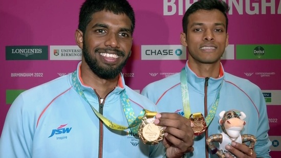 Satwiksairaj Rankireddy and Chirag Shetty pose for photograph after winning Gold in men's double Badminton at Commonwealth Games 2022(ANI)