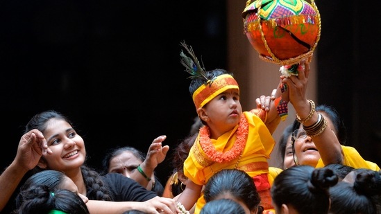 The Dahi Handi festival, also called Gopalakala or Utlotsavam, is part of Krishna Janmashtami festival which is marked a day after Janmashtami. This year, it is being observed today, August 19. As part of the festival, youngsters (called Govindas), dressed in colourful attire, make human pyramids to reach an earthen pot containing buttermilk suspended mid-air, and break it. It symbolises victory through unity.(AFP)