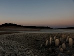 The dolmen of Guadalperal, also known as the Spanish Stonehenge, is seen due to the receding waters of the Valdecanas reservoir in the outskirts of El Gordo, Spain.