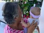 Priyanka Chopra has shared a picture of her aunt holding Malti in her arms. Priyanka Chopra has shared a picture of her aunt holding Malti in her arms.