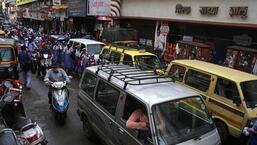 School students stuck in a traffic jam outside Huzurpaga Girls High School and Junior College on Laxmi road. (Ravindra Joshi/HT PHOTO)