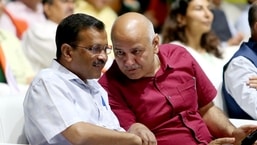 Delhi CM Arvind Kejriwal interacts with Deputy CM Manish Sisodia at the 'Har Hath Tiranga' program on the eve of Independence Day 2022, in New Delhi.. (ANI Photo)