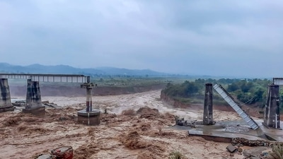 Collapsed portion of railway bridge over the Chakki river after flashfloods in Dharamshala. (PTI) Collapsed portion of railway bridge over the Chakki river after flashfloods in Dharamshala. (PTI)