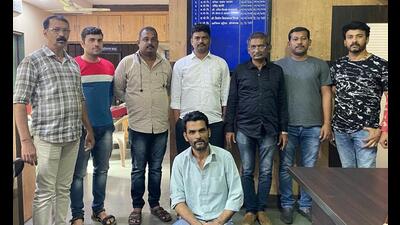 Thane Crime Branch Property Cell officials after having arrested Billal Mustafa Sayyed (squatting), a close aide of gangster Chhota Rajan. (PRAFUL GANGURDE/HT PHOTO) Thane Crime Branch Property Cell officials after having arrested Billal Mustafa Sayyed (squatting), a close aide of gangster Chhota Rajan. (PRAFUL GANGURDE/HT PHOTO)