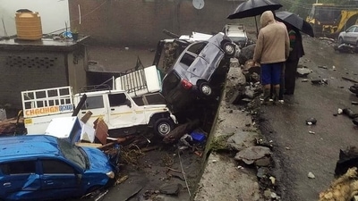 Vehicles damaged after being hit by a flash flood caused by a cloudburst at Baghi nullah in Mandi on Saturday. (ANI photo) Vehicles damaged after being hit by a flash flood caused by a cloudburst at Baghi nullah in Mandi on Saturday. (ANI photo)