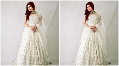 Mouni played muse to fashion designer house Shakuntlam and picked a white anarkali set from the shelves of the designer. (Instagram/@imouniroy)