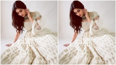 Styled by fashion stylist Anuradha Khurana, Mouni wore her tresses open in soft wavy curls with a middle part as she posed for the pictures. “For the love of white and Gokul ashtami,” wrote Mouni in the caption. (Instagram/@imouniroy)