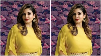 Raveena's long yellow silk gown came with kaftan-styled sleeves and a belt detail, styled in embellishments. The gown hugged Raveena's shape and featured minimal knotted details below the waist. (Instagram/@officialraveenatandon)