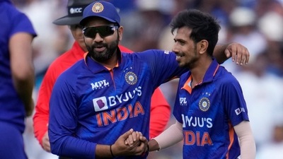 India spinner Yuzvendra Chahal (right) with Captain Rohit Sharma (AP) India spinner Yuzvendra Chahal (right) with Captain Rohit Sharma (AP)