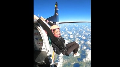 The image, taken from the viral Instagram video, shows a woman hanging from the plane and working out.&nbsp; (Instagram/@katievasenina)