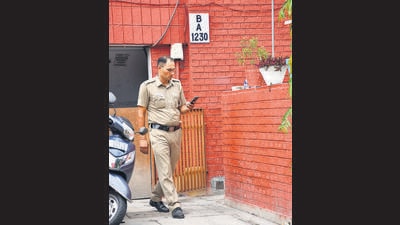 A police official at the victim’s house in Sector 41, Chandigarh, where the murder took place around 5.15 am. (Ravi Kumar/HT) A police official at the victim’s house in Sector 41, Chandigarh, where the murder took place around 5.15 am. (Ravi Kumar/HT)