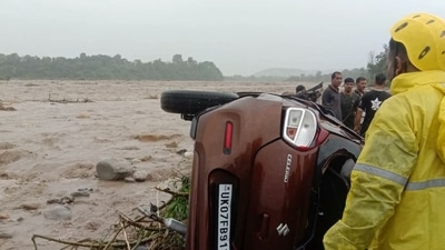 SDRF team rescuing a man stuck in a car in Soda Saroli village of Dehradun. (SDRF Uttarakhand Police) SDRF team rescuing a man stuck in a car in Soda Saroli village of Dehradun. (SDRF Uttarakhand Police)