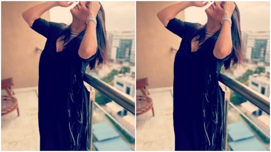 Neha decked up in a black satin long dress that featured a plunging neckline and long sleeves.(Instagram/@nehadhupia)