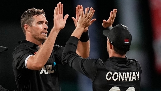 New Zealand's Tim Southee celebrates with teammate Devon Conway the dismissal of West Indies' Alzarri Joseph during the second ODI (AP)