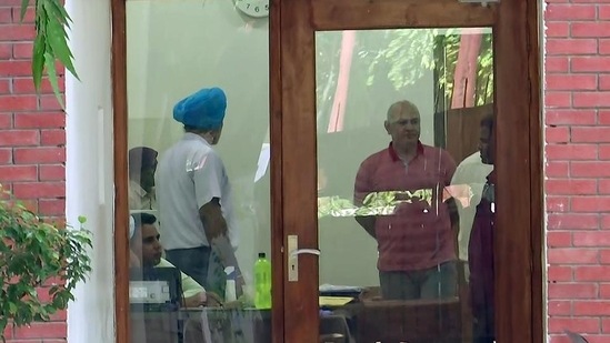 Delhi deputy CM Manish Sisodia at his residence during a CBI raid in connection with alleged irregularities in Delhi Excise Policy on Friday. (ANI) Delhi deputy CM Manish Sisodia at his residence during a CBI raid in connection with alleged irregularities in Delhi Excise Policy on Friday. (ANI)