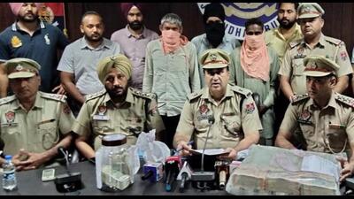 Police officials with the arrested accused and the drug money recovered from them in Jalandhar on Sunday. HT photo